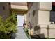 Inviting entryway with walkway and potted plants at 9016 Sundial Dr, Las Vegas, NV 89134