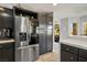 Modern kitchen with stainless steel refrigerator and ample cabinet space at 9016 Sundial Dr, Las Vegas, NV 89134