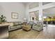 Spacious living room with leather sofas and a neutral color scheme at 9016 Sundial Dr, Las Vegas, NV 89134