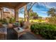 Relaxing patio with wicker furniture offering a view of the golf course at 9016 Sundial Dr, Las Vegas, NV 89134