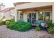 Covered patio with seating area and lush landscaping at 9016 Sundial Dr, Las Vegas, NV 89134