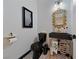 Elegant powder room with black fixtures and gold accents at 9048 Rich Amethyst Ct, Las Vegas, NV 89149