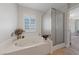 Relaxing bathroom featuring a jetted tub and a separate shower at 9048 Rich Amethyst Ct, Las Vegas, NV 89149