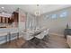 Elegant dining area with a glass table and modern chairs at 9048 Rich Amethyst Ct, Las Vegas, NV 89149