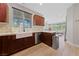 Modern kitchen with farmhouse sink and stainless steel appliances at 9048 Rich Amethyst Ct, Las Vegas, NV 89149