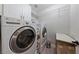 Convenient laundry room with washer, dryer, and extra storage at 9048 Rich Amethyst Ct, Las Vegas, NV 89149