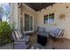 Cozy patio area with fire pit and comfortable seating at 9048 Rich Amethyst Ct, Las Vegas, NV 89149