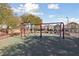 Community playground with swings for children at 9048 Rich Amethyst Ct, Las Vegas, NV 89149