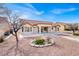 Landscaped backyard with patio and desert landscaping at 9308 Cactus Wood Dr, Las Vegas, NV 89134