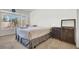 Main bedroom with large bed, window seat, and ample natural light at 9308 Cactus Wood Dr, Las Vegas, NV 89134