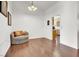 Bright dining area with hardwood floors and kitchen access at 9308 Cactus Wood Dr, Las Vegas, NV 89134