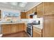 Kitchen with wood cabinets and stainless steel appliances at 9308 Cactus Wood Dr, Las Vegas, NV 89134