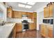 Well-equipped kitchen with stainless steel appliances and wood cabinets at 9308 Cactus Wood Dr, Las Vegas, NV 89134