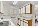 Laundry room featuring washer, dryer, and storage cabinets at 9308 Cactus Wood Dr, Las Vegas, NV 89134