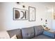 Living Room with grey couch and modern wall art at 950 Seven Hills Dr # 2017, Henderson, NV 89052