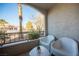 Outdoor patio with chairs and small table at 950 Seven Hills Dr # 2017, Henderson, NV 89052