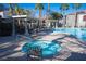 Community pool and spa with lounge chairs and a pergola at 950 Seven Hills Dr # 2017, Henderson, NV 89052