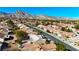 Aerial view of homes and community with mountain views at 9921 Heyfield Dr, Las Vegas, NV 89134