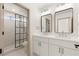 Double vanity bathroom with modern mirrors and lighting at 9921 Heyfield Dr, Las Vegas, NV 89134