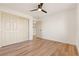 Bedroom with double door closet and wood-look floors at 9921 Heyfield Dr, Las Vegas, NV 89134