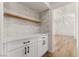 White built-in cabinetry with wood shelving and quartz countertop at 9921 Heyfield Dr, Las Vegas, NV 89134