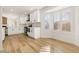 Bright kitchen with white cabinets and wood flooring at 9921 Heyfield Dr, Las Vegas, NV 89134