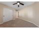 Well-lit bedroom featuring a ceiling fan and double closet at 10229 Angels Loft St, Las Vegas, NV 89131