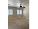 Large bedroom with carpeted floors and ceiling fan at 10229 Angels Loft St, Las Vegas, NV 89131