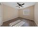 Bedroom with wood flooring and large window with plantation shutters at 10229 Angels Loft St, Las Vegas, NV 89131