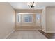 Bright breakfast nook features a built-in window seat and tile flooring at 10229 Angels Loft St, Las Vegas, NV 89131