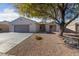 Single-story house with attached garage and landscaped front yard at 10229 Angels Loft St, Las Vegas, NV 89131