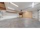 Two-car garage with overhead storage and built-in cabinets at 10229 Angels Loft St, Las Vegas, NV 89131