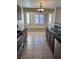 Bright kitchen with dark cabinets, stainless steel appliances and bay window at 10229 Angels Loft St, Las Vegas, NV 89131