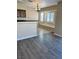 Kitchen with an island, dark wood cabinets, and gray flooring at 10229 Angels Loft St, Las Vegas, NV 89131