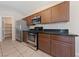 Modern kitchen with stainless steel appliances and wood cabinetry at 10229 Angels Loft St, Las Vegas, NV 89131