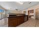 Large kitchen island with granite countertop and stainless steel sink at 10229 Angels Loft St, Las Vegas, NV 89131