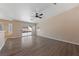 Living room with hardwood floors, sliding door, and fan at 10229 Angels Loft St, Las Vegas, NV 89131