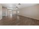 Open living room with hardwood floors and access to backyard at 10229 Angels Loft St, Las Vegas, NV 89131