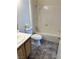 Bathroom with shower/tub combo and wood vanity at 1533 Linnbaker Ln # 201, Las Vegas, NV 89110