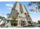 Modern high-rise building exterior with palm trees at 200 Hoover Ave # 1101, Las Vegas, NV 89101