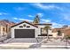 Front view of a remodeled home with desert landscaping at 2276 Ray Kanel Dr, Las Vegas, NV 89156