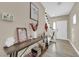 Inviting entryway with stylish console table and view to the living room at 2314 Rock Slide Cir, Las Vegas, NV 89115