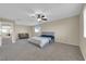 Large main bedroom with ceiling fan and sitting area at 2314 Rock Slide Cir, Las Vegas, NV 89115