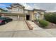 Two-story house with attached two-car garage and landscaped front yard at 2438 Ping Drive, Henderson, NV 89074