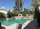 Inviting backyard pool with spa and lush landscaping at 2438 Ping Drive, Henderson, NV 89074