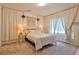 Cozy bedroom with queen bed, lamps and neutral decor at 25 Barbara Ln # 42, Las Vegas, NV 89183