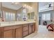 Bathroom with double vanity and a view into the bedroom at 251 Castellari Dr, Las Vegas, NV 89138