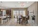 Elegant dining area with a table for six and sliding doors to patio at 251 Castellari Dr, Las Vegas, NV 89138