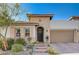 Single-story home with stone accents and a two-car garage at 251 Castellari Dr, Las Vegas, NV 89138
