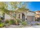 Landscaped front yard with drought-tolerant plants and a walkway at 251 Castellari Dr, Las Vegas, NV 89138